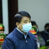 Cựu Chủ tịch UBND thành phố Hà Nội Nguyễn Đức Chung khai báo trước tòa. (Ảnh: TTXVN)