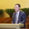 Tổng Thanh tra Chính phủ Đoàn Hồng Phong trình bày Báo cáo về công tác tiếp công dân, giải quyết khiếu nại, tố cáo. (Ảnh: Doãn Tấn/TTXVN)