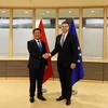 Bộ trưởng Bộ Công Thương Nguyễn Hồng Diên và Phó Chủ tịch EC kiêm Cao ủy Thương mại EU Valdis Dombrovskis. (Ảnh: Hương Giang/TTXVN)