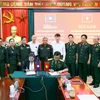 Đại diện Hội Cựu Chiến binh tỉnh Sơn La và Hiệp Hội Cựu Chiến binh tỉnh Xayabury ký kết biên bản ghi nhớ. (Ảnh: Quang Quyết/TTXVN)