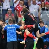 Đội tuyển Croatia ăn mừng sau khi giành vé đi tiếp với chiến thắng 4-3 sau loạt sút penalty trước đối thủ Đan Mạch. (Nguồn: THX/TTXVN)
