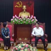 Tổng Giám đốc TTXVN Vũ Việt Trang làm việc với Bí thư Tỉnh ủy Sơn La Nguyễn Hữu Đông. (Ảnh: Quang Quyết/TTXVN)