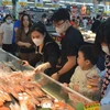 Người dân háo hức tham gia mua sắm tại sự kiện “Hà Nội đêm không ngủ-HaNoi Midnight Sale” 2023 ở BigC. (Ảnh: Phương Anh/TTXVN)