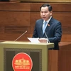 Chủ nhiệm Ủy ban Tài chính, Ngân sách của Quốc hội Lê Quang Mạnh báo cáo Quốc hội. (Ảnh: CTV/Vietnam+)
