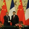 Tổng thống Pháp Emmanuel Macron (trái) và Chủ tịch Trung Quốc Tập Cận Bình tại cuộc gặp ở Bắc Kinh ngày 6/11/2019. (Nguồn: AFP/TTXVN) 