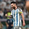 Niềm vui của Lionel Messi khi kiến tạo đường chuyền giúp Alvarez ghi bàn thắng thứ ba cho đội nhà trước Croatia. (Ảnh: AFP/TTXVN)