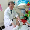 Điều kỳ diệu đã đến với cô bé 'chân voi' Nguyễn Thị Loan khi em được sang Đài Loan chữa bệnh. (Ảnh: Minh Sơn/Vietnam+)