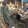 Lực lượng cứu hộ Thái Lan làm việc tại hiện trường vụ nổ bom tại Yala ngày 25/7/2014. (Ảnh: AFP/TTXVN)