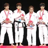 Thanh Thủy (thứ hai từ trái) lần đầu tham dự SEA Games đã giành huy chương vàng. (Nguồn: Thể thao & Văn hóa)