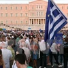 Người dân Hy Lạp tuần hành ủng hộ kế hoạch cải cách tại thủ đô Athens ngày 9/7. (Nguồn: AFP/TTXVN)