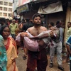Một người phụ nữ bị thương sau vụ hỗn loạn. (Ảnh: Hindustan Times)