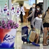 Khách du lịch đeo khẩu trang để phòng tránh lây nhiễm MERS tại thủ đô Seoul, Hàn Quốc ngày 17/6/2015. (Nguồn: AFP/TTXVN)