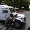  Lực lượng an ninh Ấn Độ làm nhiệm vụ tại tòa nhà Quốc hội ở thủ đô New Delhi ngày 27/7 sau khi xảy ra vụ tấn công khủng bố tại bang Punjap. (Ảnh: AFP/TTXVN)