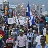 Người dân Honduras biểu tình yêu cầu tổng thống từ chức. (Ảnh: AP)