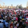 Hàng nghìn người từ khắp Liban đổ về ở trung tâm thủ đô Beirut để tham gia cuộc biểu tình. (Ảnh: AFP/TTXVN)