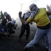 Người dân Palestine xung đột với lính Israel ở Bờ Tây, ngày 9/10. (Nguồn: AFP)