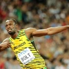 Usain Bolt vừa đăng quang tại Giải vô địch điền kinh thế giới ở Bắc Kinh. (Ảnh: AFP)