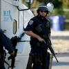Cảnh sát Mỹ truy đuổi nghi phạm vụ tấn công. (Nguồn: AFP/TTXVN)