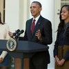 Tổng thống Mỹ Barack Obama cùng hai con gái. (Ảnh: Chip Somodevilla/Getty Images)