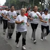 Người dân tham gia hưởng ứng Chạy Olympic vì sức khỏe toàn dân. (Ảnh: Quốc Khánh/TTXVN)