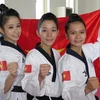 Đội tuyển taekwondo nữ giành huy chương vàng. (Ảnh: TTXVN)