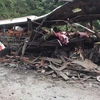 Hiện trường vụ nổ xe khách ở Lào. (Ảnh: Nguyễn Chiến/Vietnam+)