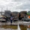 Ba xe container bị cháy rụi. (Ảnh: TTXVN)