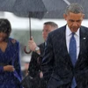 Tổng thống Mỹ Barack Obama nhường ô cho vợ. (Nguồn: Getty Images)