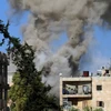 Khói bốc lên sau vụ oanh kích ở Aleppo, Syria. (Nguồn: AFP)