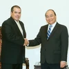 Thủ tướng Nguyễn Xuân Phúc tiếp ông Luis Enrique Gonzalez Acosta, Chủ tịch Thông tấn xã Prensa Latina (Cuba) đang ở thăm và làm việc tại Việt Nam. (Ảnh: Thống Nhất/TTXVN)