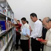 Quang cảnh phòng thư viện tại Trụ sở Tổng hội người Việt Nam tại Lào. (Ảnh: Phạm Kiên/Vietnam+)