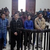 Các bị cáo tại phiên tòa sơ thẩm. (Ảnh: Nguyễn Hoàng/TTXVN)