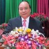 Thủ tướng Nguyễn Xuân Phúc đến thăm, chúc Tết Đảng bộ, chính quyền, nhân dân và các lực lượng vũ trang thành phố Đà Nẵng. (Ảnh: Văn Sơn/TTXVN)