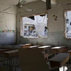 Cảnh một lớp học ở Syria bị tấn công. (Nguồn: Reuters)