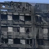 Tòa nhà Grenfell Tower bị phá hủy sau vụ hỏa hoạn hôm 14/6. (Nguồn: EPA/TTXVN)