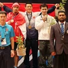 Thạch Kim Tuấn (giữa) trên bục nhận HCV SEA Games 29. (Ảnh: Quốc Khánh/TTXVN)