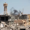 Cảnh đổ nát sau các cuộc đụng độ ở thành phố Sirte . (Nguồn: Reuters)