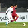 Lối chơi của U23 Qatar (áo đỏ) gặp khó trước U23 Việt Nam. (Nguồn: AFC)