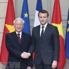 Tổng Bí thư Nguyễn Phú Trọng và Tổng thống Cộng hòa Pháp Emmanuel Macron. (Ảnh: Trí Dũng/TTXVN)