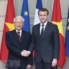 Tổng Bí thư Nguyễn Phú Trọng và Tổng thống Cộng hòa Pháp Emmanuel Macron. (Ảnh: Trí Dũng/TTXVN)