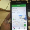 Ứng dụng phần mềm gọi xe của Grab. (Ảnh: Việt Hùng/Vietnam+)