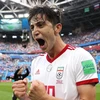 Niềm vui của cầu thủ Iran sau chiến thắng. (Nguồn: Getty Images)