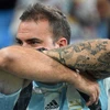 Một cổ động viên Argentina buồn bã sau thất bại của đội nhà. (Nguồn: AFP)