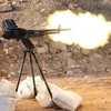Quân nổi dậy nã súng vào mục tiêu của lực lượng ủng hộ Chính phủ Syria ở Aleppo hồi đầu năm. (Nguồn: AFP/TTXVN)
