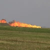 Máy bay bốc cháy sau khi rơi. (Nguồn: theaviationist.com)