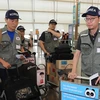 Đội cứu trợ thảm họa Hàn Quốc tại sân bay Incheon trước khi lên đường tới Lào ngày 26/7. (Ảnh: EPA/TTXVN)