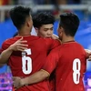 Olympic Việt Nam sẽ mặc trang phục đỏ khi đá trận ra quân. (Ảnh: Trọng Đạt/TTXVN)
