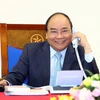 Thủ tướng Nguyễn Xuân Phúc chúc mừng đội tuyển Olympic Việt Nam. (Ảnh: Thống Nhất/TTXVN)