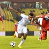Malaysia (áo trắng) thua trước thềm AFF Cup. (Nguồn: AP)