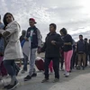 Người nhập cư tại khu vực cảng El Chaparral ở Tijuana, biên giới Mexico-Mỹ. (Nguồn: AFP/TTXVN)